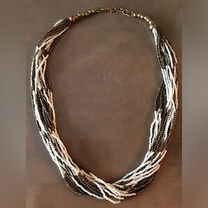 Beaded necklace with gold tone and white beads. Bay Area origin
